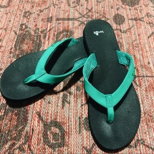teal sanuk flip flops